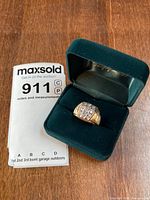 Ring in presentation box with appraisal document visible