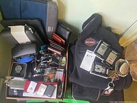 Overview of jackets, lighters, sunglasses, wallets, watch, flask and accessories