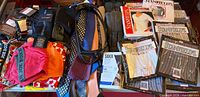 Full overview of lot displaying underwear, belts, ties, gloves, socks and undershirt packages