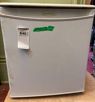 Front view of Simplicity mini refrigerator showing door and handle