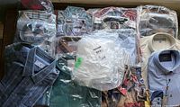 Overview of folded, packaged dress shirts on table