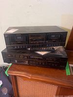 Optimus SCT-41 cassette deck stacked on Realistic CD-6000 changer with remote and cables visible