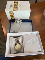 Watch in inner box with outer sleeve and manual visible