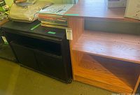 Black MDF unit beside wood-grain unit showing overall condition and design