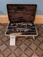 Full view of clarinet sections arranged in open case