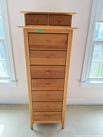 Front view of Copeland tall lingerie chest showing seven main drawers and removable two-drawer top