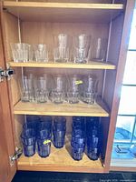 Cabinet shelves with clear and blue tumblers