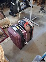 Both suitcases standing upright in garage setting