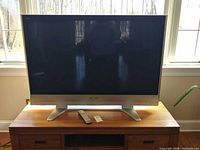 Front view of Panasonic 50-inch TV on stand