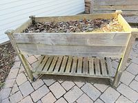 Full view of raised wood planter showing overall structure