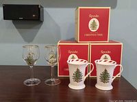 Wine glasses, mugs and three Spode Christmas Tree boxes