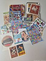 Assortment overview showing sticker sheets and luggage label prints