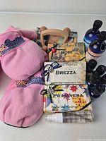 All items grouped: slippers, soaps, massage tool, oil bottles, spray vial