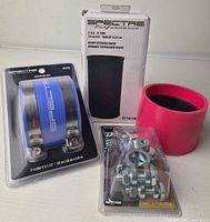 All four packaged components: Spectre intake tube box, blue coupler kit, pink adapter, Duralast terminals