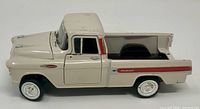 Left side view of die-cast 1958 Chevrolet Apache Fleetside pickup