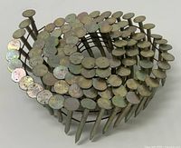 close-up of a single coil of flat-head galvanized nails
