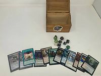 Open wood box, dice and cards displayed