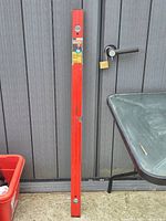 Full view of 4-foot Craftsman red level leaning against wall