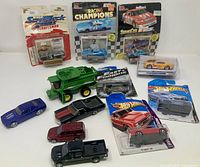 Overall lot showing packaged and loose diecast vehicles