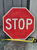 Front of stop sign showing marker graffiti and wear