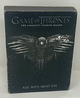 Front of slipcase showing title and raven artwork