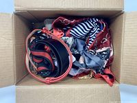 Box showing belts, scarves, assorted accessories