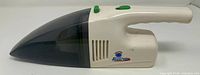 Left side profile of handheld vacuum showing Power Vac logo, dust bin, handle, switches