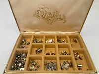 open jewelry case showing contents in compartments