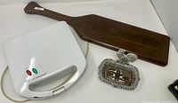 closed waffle maker, wood board, soap dish overview
