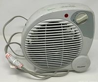 Front view of Pelonis HB-211T heater showing grille, control knob, indicator light and power cord