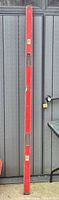 Full view of 6-ft red aluminum level leaning vertically