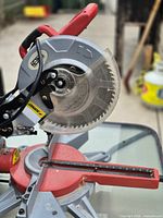 Front left view showing blade, guard, base, and miter gauge