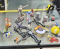 Overall lot on glass table with measuring tape for scale