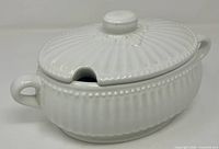 Tureen with lid in place showing ladle notch and handles