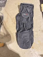 Full view of folded black 99golf travel bag