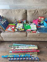 Full lot on couch and floor showing bags, rolls, accessories