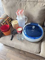 Group shot of majority of items including grill, popsicle mold, pitcher, steamer, buckets, candle, bowl and mini pan