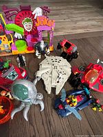 Overall lot with Joker Fun House, Millennium Falcon, vehicles and figures