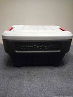 Front view showing lid, red latch handles, overall condition