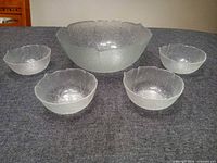 Full set showing large bowl and four small bowls