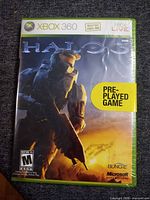 Front of shrink-wrapped Halo 3 Xbox 360 case with pre-played sticker visible