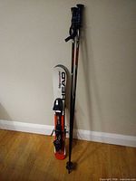 Full view of skis with bindings and accompanying poles