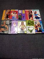 Front covers of 10 fitness VHS tapes laid out in two rows