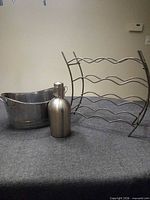 Wine rack, ice tub, swing-top bottle displayed together