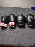 Four boxing gloves showing ProForce and Main Event branding