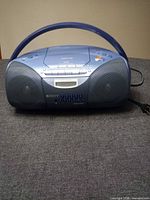 Front view of Sony blue boombox showing speakers, cassette deck and control panel