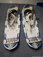 Top view of both snowshoes showing bindings, decking design, and Tubbs branding