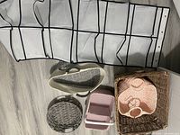 All items laid out showing organizer folded and various baskets and bin