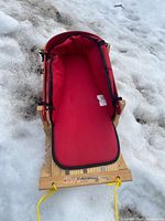 Top view of sled showing red padded liner and overall design