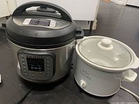 Instant Pot Duo multi-cooker next to Rival Crock-Pot side by side